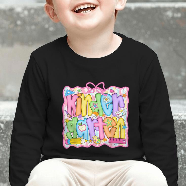 Kindergarten Coquette Bow Back To School Kinder Girl Kids Graphic Toddler Long Sleeve Tee Kindergarten Coquette Bow Back To School Kinder Girl Kids Graphic Toddler Long Sleeve Tee