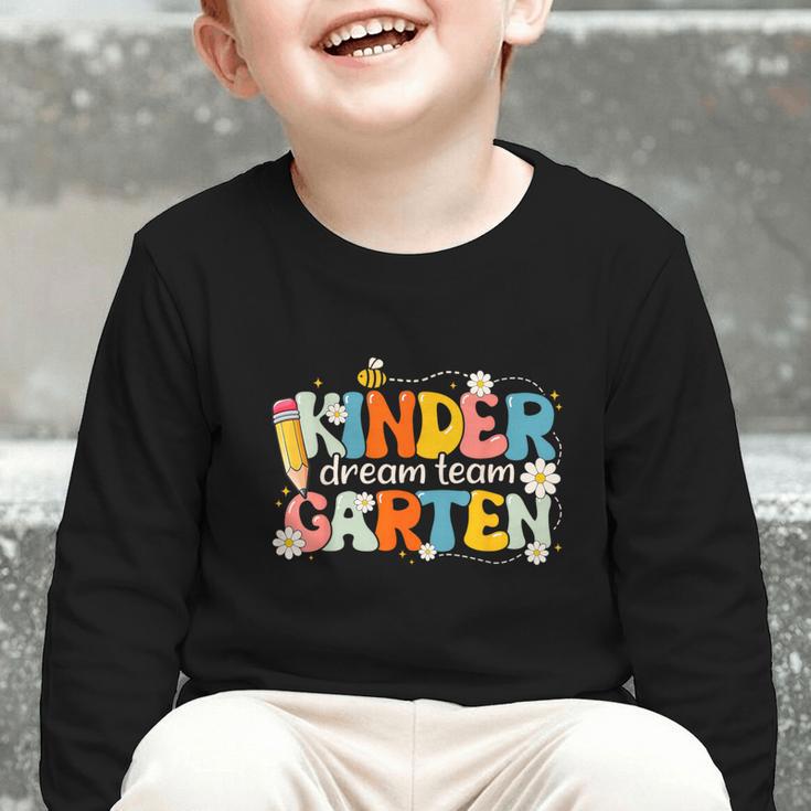 Kindergarten Dream Team Groovy Retro Children Back To School Graphic Toddler Long Sleeve Tee Kindergarten Dream Team Groovy Retro Children Back To School Graphic Toddler Long Sleeve Tee