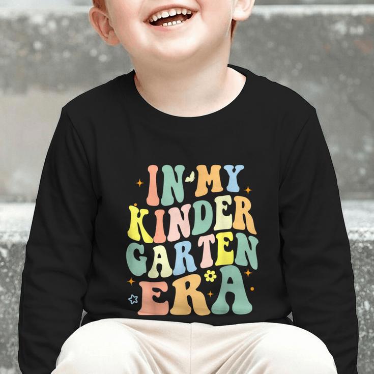 Kindergarten Era Happy Back To School Groovy Kids Boys Girls Graphic Toddler Long Sleeve Tee Kindergarten Era Happy Back To School Groovy Kids Boys Girls Graphic Toddler Long Sleeve Tee