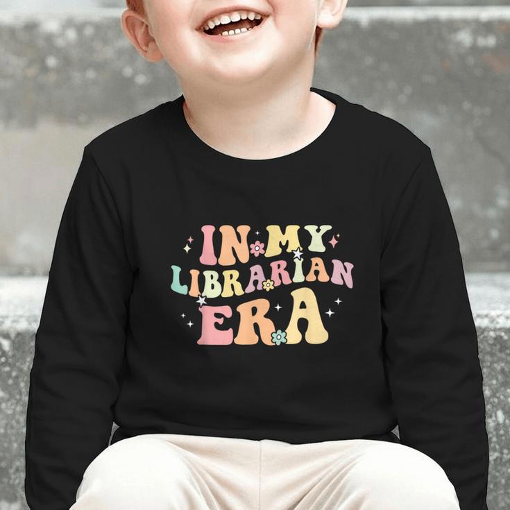 In My Librarian Era Retro Back To School Bookworm Book Lover Graphic Toddler Long Sleeve Tee In My Librarian Era Retro Back To School Bookworm Book Lover Graphic Toddler Long Sleeve Tee