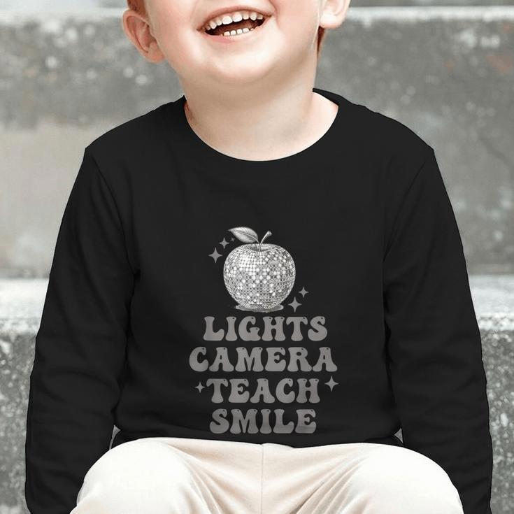 Lights Camera Teach Smile Disco-Ball Back To School Outfit Graphic Toddler Long Sleeve Tee Lights Camera Teach Smile Disco-Ball Back To School Outfit Graphic Toddler Long Sleeve Tee