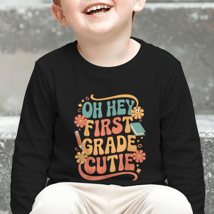 Oh Hey First Grade Cutie Back To School Graphic Toddler Long Sleeve Tee Oh Hey First Grade Cutie Back To School Graphic Toddler Long Sleeve Tee