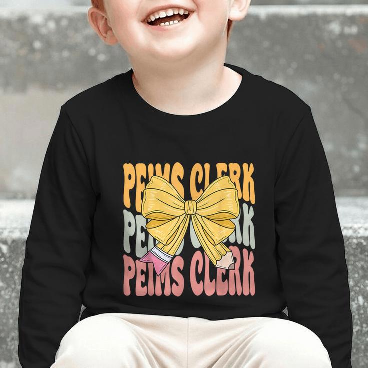 Peims Clerk Groovy Coquette Bow Cute Back To School Graphic Toddler Long Sleeve Tee Peims Clerk Groovy Coquette Bow Cute Back To School Graphic Toddler Long Sleeve Tee