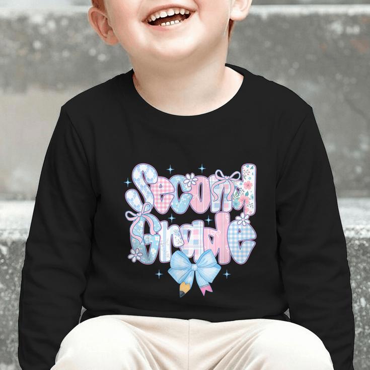 Preppy Second Grade First Day Back To School 2nd Grade Bow Graphic Toddler Long Sleeve Tee
