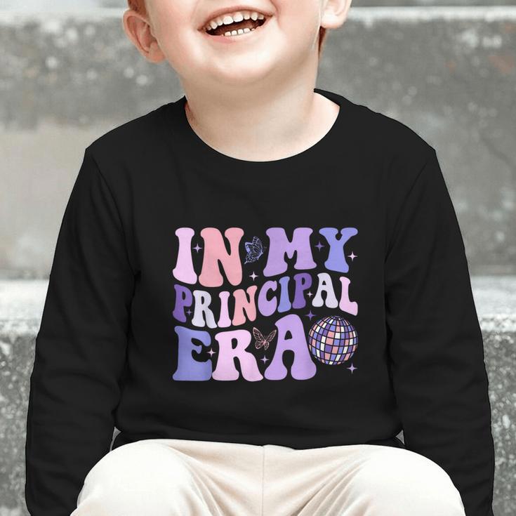 In My Principal Era Groovy School Headmaster Back To School Graphic Toddler Long Sleeve Tee In My Principal Era Groovy School Headmaster Back To School Graphic Toddler Long Sleeve Tee