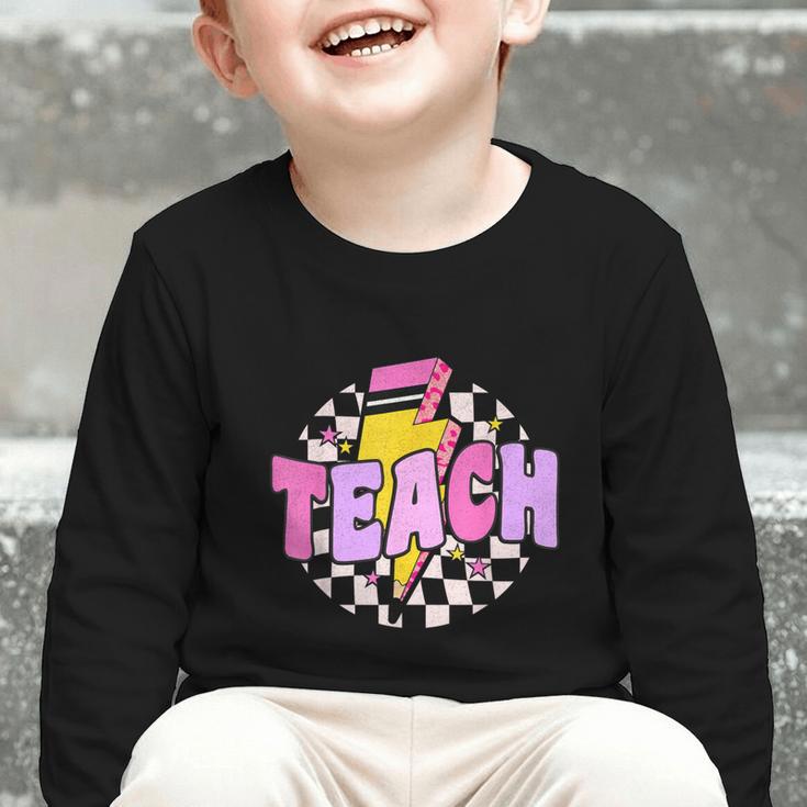 Retro Checkered Teach Pencil Lightning Back To School Graphic Toddler Long Sleeve Tee Retro Checkered Teach Pencil Lightning Back To School Graphic Toddler Long Sleeve Tee