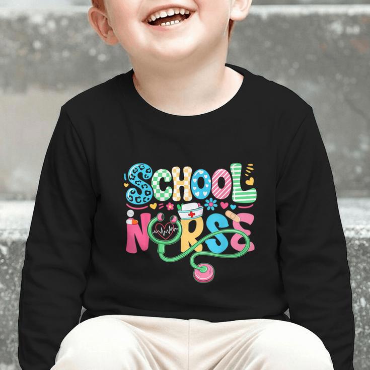 School Nurse Colorful Costume Back To School Nursing Job Graphic Toddler Long Sleeve Tee School Nurse Colorful Costume Back To School Nursing Job Graphic Toddler Long Sleeve Tee