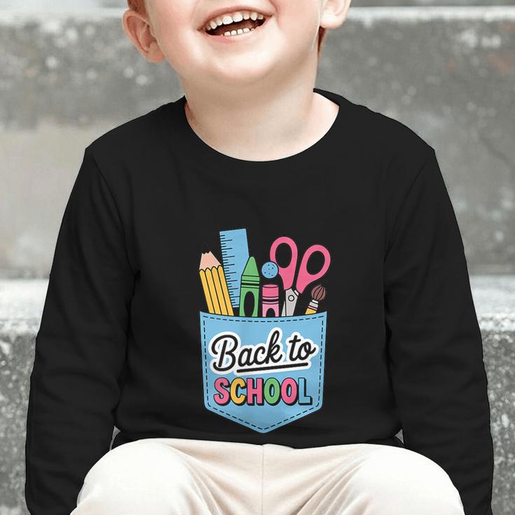 School Supplies In Pocket Back To School Boys Girls Graphic Toddler Long Sleeve Tee School Supplies In Pocket Back To School Boys Girls Graphic Toddler Long Sleeve Tee
