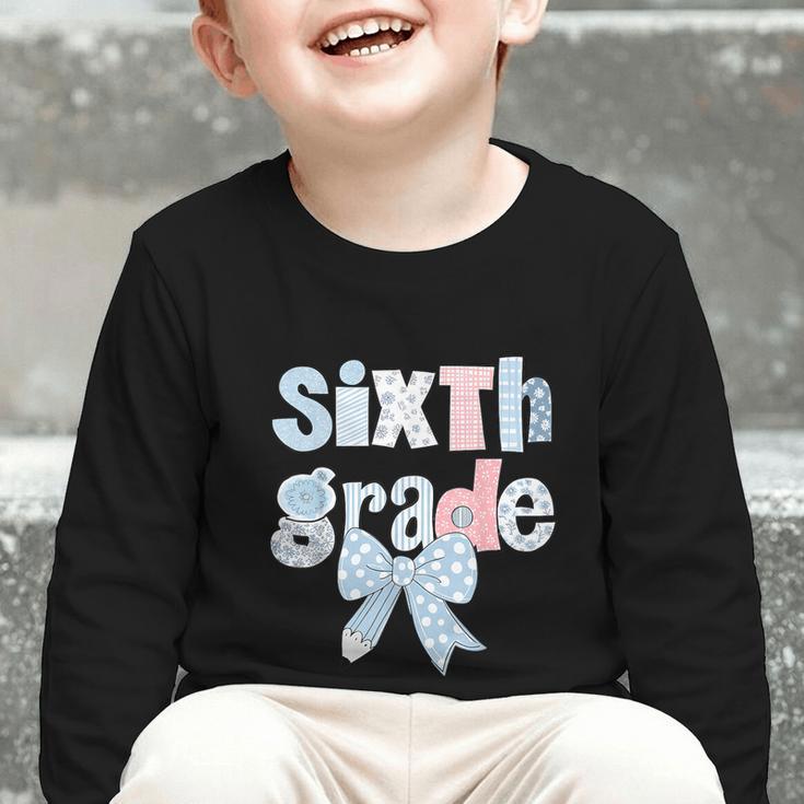 Sixth Grade Coquette Bow Pencil First Day Back To School Graphic Toddler Long Sleeve Tee Sixth Grade Coquette Bow Pencil First Day Back To School Graphic Toddler Long Sleeve Tee