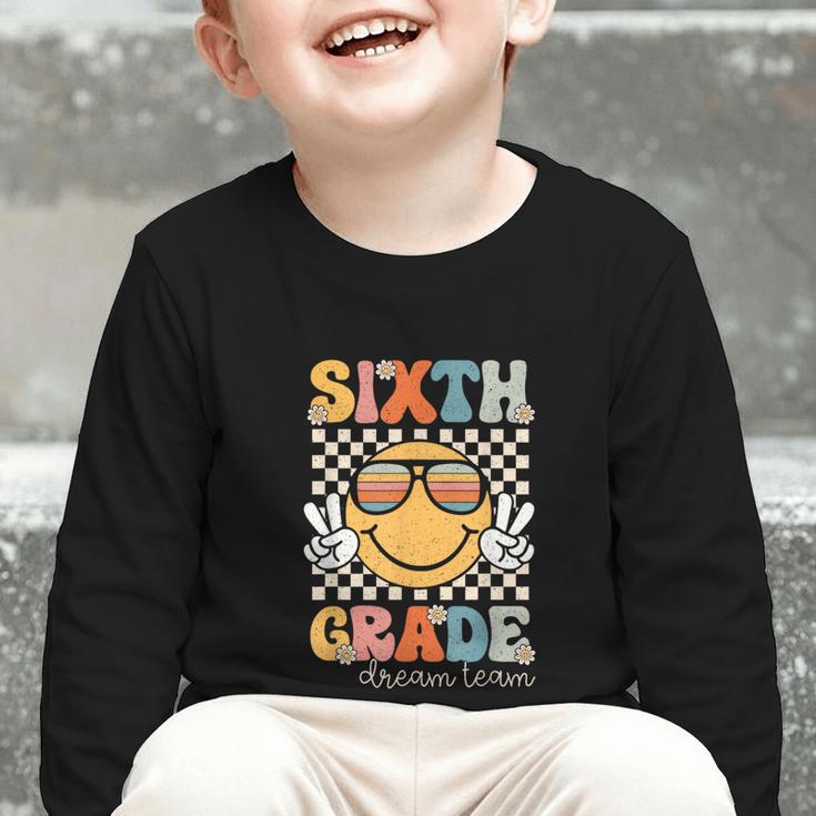 Sixth Grade Dream Team Smile Retro Back To School 6th Grade Graphic Toddler Long Sleeve Tee Sixth Grade Dream Team Smile Retro Back To School 6th Grade Graphic Toddler Long Sleeve Tee