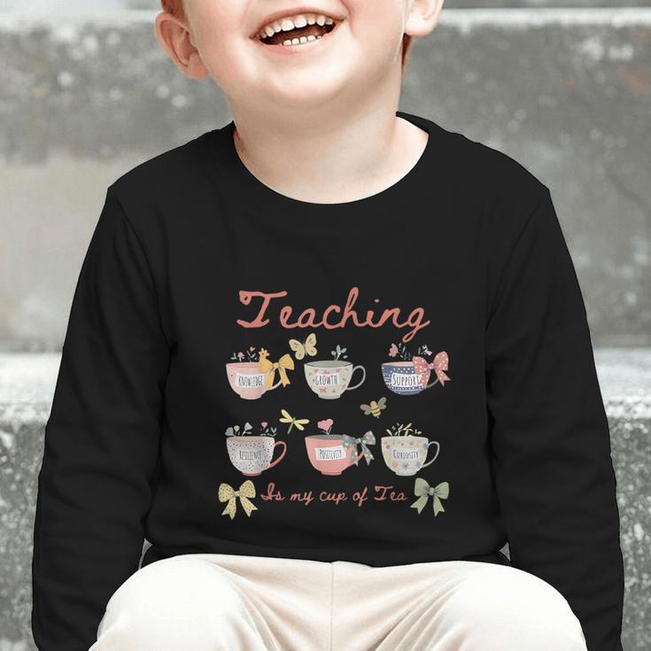 Teaching Is My Cup Of Tea Coquette Bow Floral Back To School Graphic Toddler Long Sleeve Tee Teaching Is My Cup Of Tea Coquette Bow Floral Back To School Graphic Toddler Long Sleeve Tee
