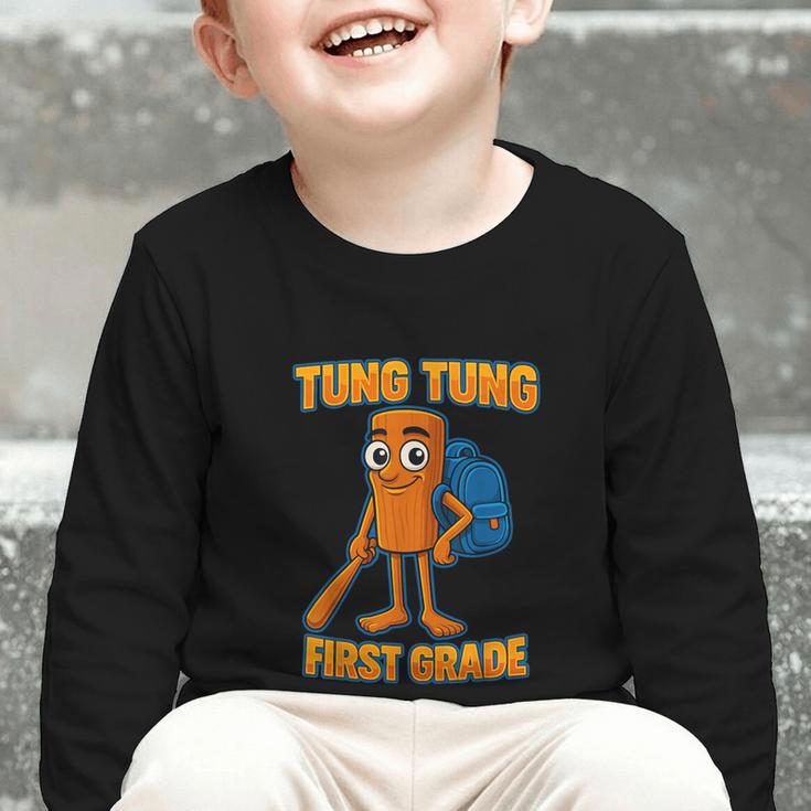 Tung Tung Sahur First Grade Italian Brainrot Back To School Graphic Toddler Long Sleeve Tee Tung Tung Sahur First Grade Italian Brainrot Back To School Graphic Toddler Long Sleeve Tee