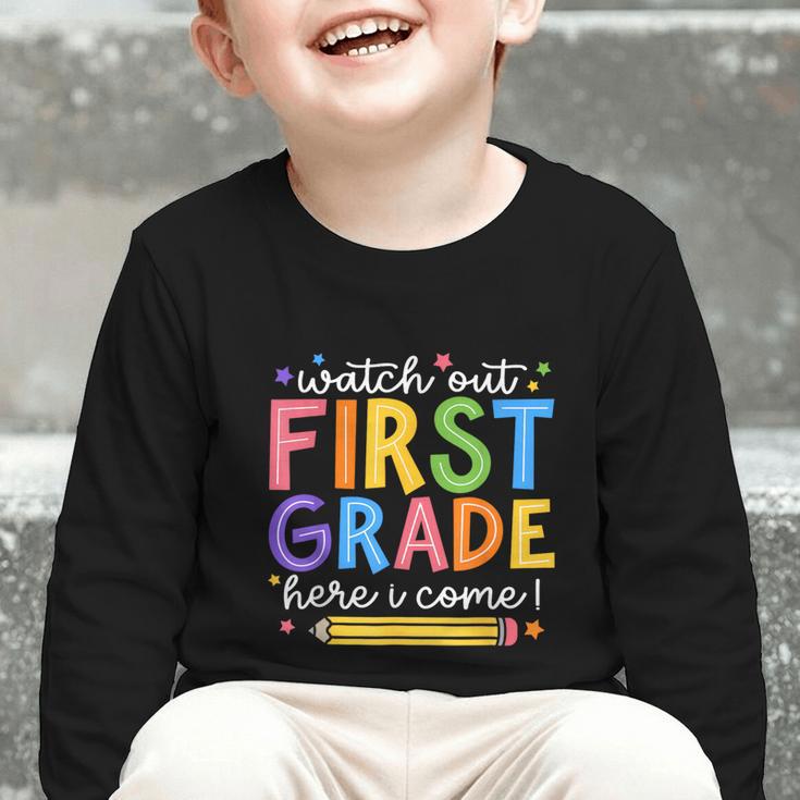 Watch Out First Grade Here I Come 1St Grade Back To School Graphic Toddler Long Sleeve Tee