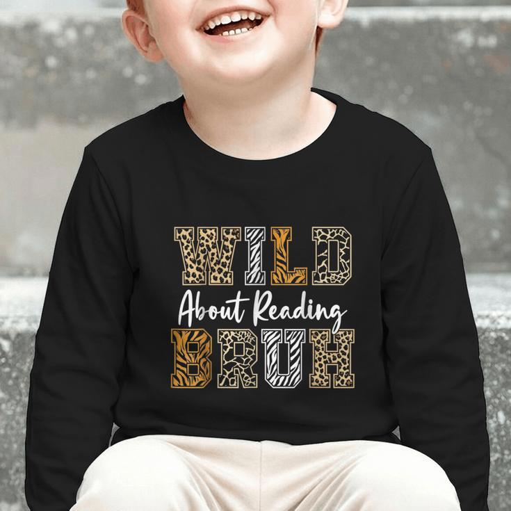 Wild About Reading Kid Love Wild Animal Books Back To School Graphic Toddler Long Sleeve Tee Wild About Reading Kid Love Wild Animal Books Back To School Graphic Toddler Long Sleeve Tee