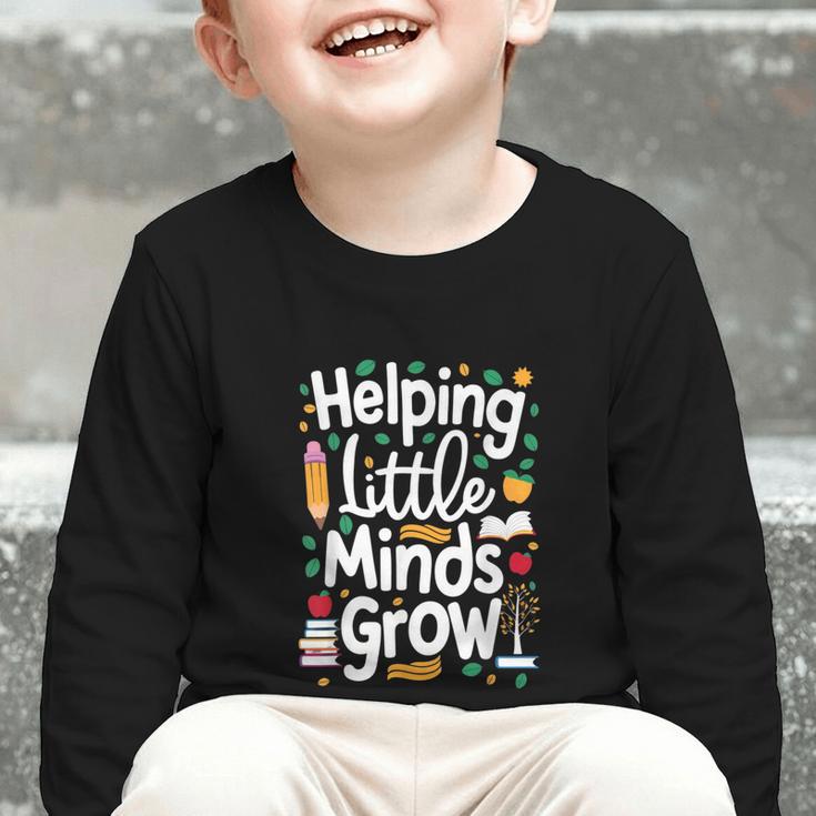 Women's Helping Little Minds Grow Back To School Apparel Graphic Toddler Long Sleeve Tee Women's Helping Little Minds Grow Back To School Apparel Graphic Toddler Long Sleeve Tee