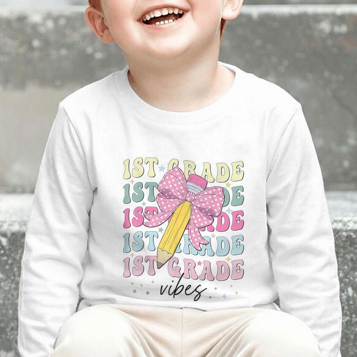 1st Grade Vibes Girl Coquette Bow First Grade Back To School Graphic Toddler Long Sleeve Tee 1st Grade Vibes Girl Coquette Bow First Grade Back To School Graphic Toddler Long Sleeve Tee