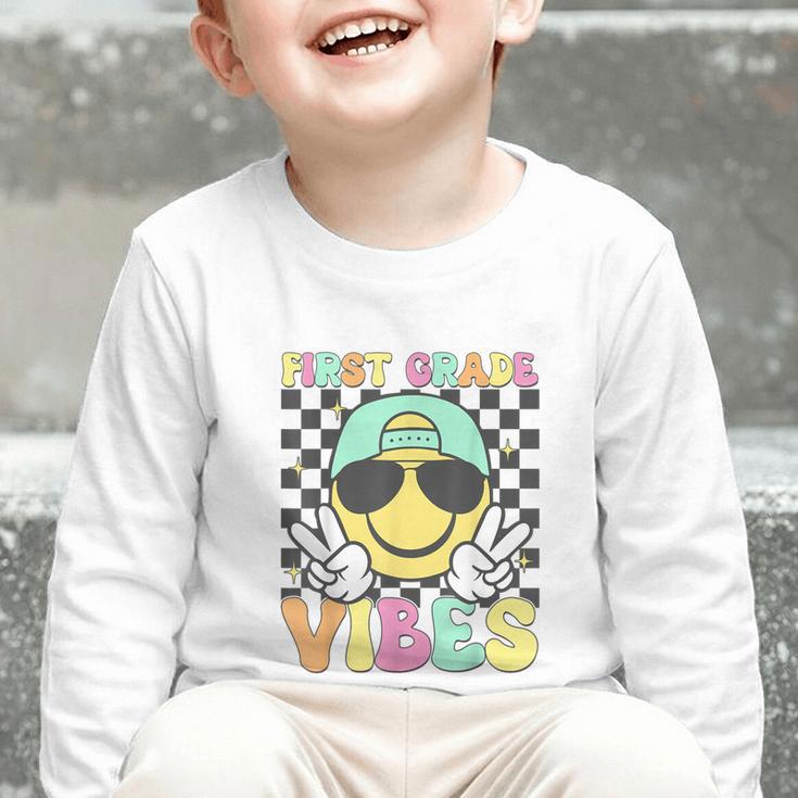 1st Grade Vibes Smile Face Back To School First Grade Graphic Toddler Long Sleeve Tee 1st Grade Vibes Smile Face Back To School First Grade Graphic Toddler Long Sleeve Tee