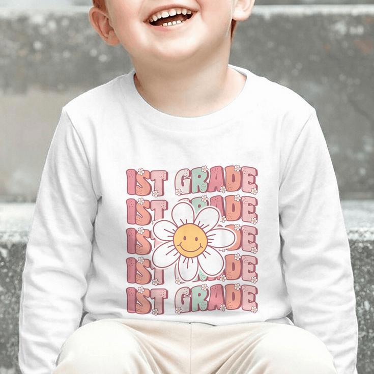 70s Groovy 1st Grade Back To School First Day Of First Grade Graphic Toddler Long Sleeve Tee 70s Groovy 1st Grade Back To School First Day Of First Grade Graphic Toddler Long Sleeve Tee