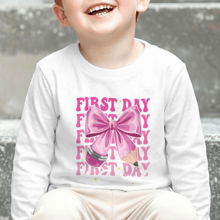 First Day Of School Girls Coquette Bow Back To School Performance Graphic Toddler Long Sleeve Tee First Day Of School Girls Coquette Bow Back To School Performance Graphic Toddler Long Sleeve Tee