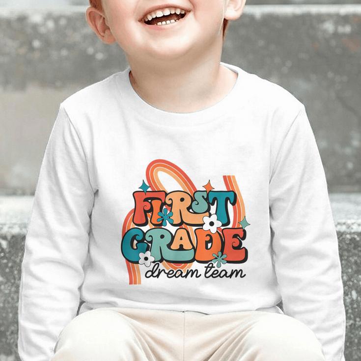 First Grade Dream Team First Day Of 1st Grade Back To School Graphic Toddler Long Sleeve Tee First Grade Dream Team First Day Of 1st Grade Back To School Graphic Toddler Long Sleeve Tee