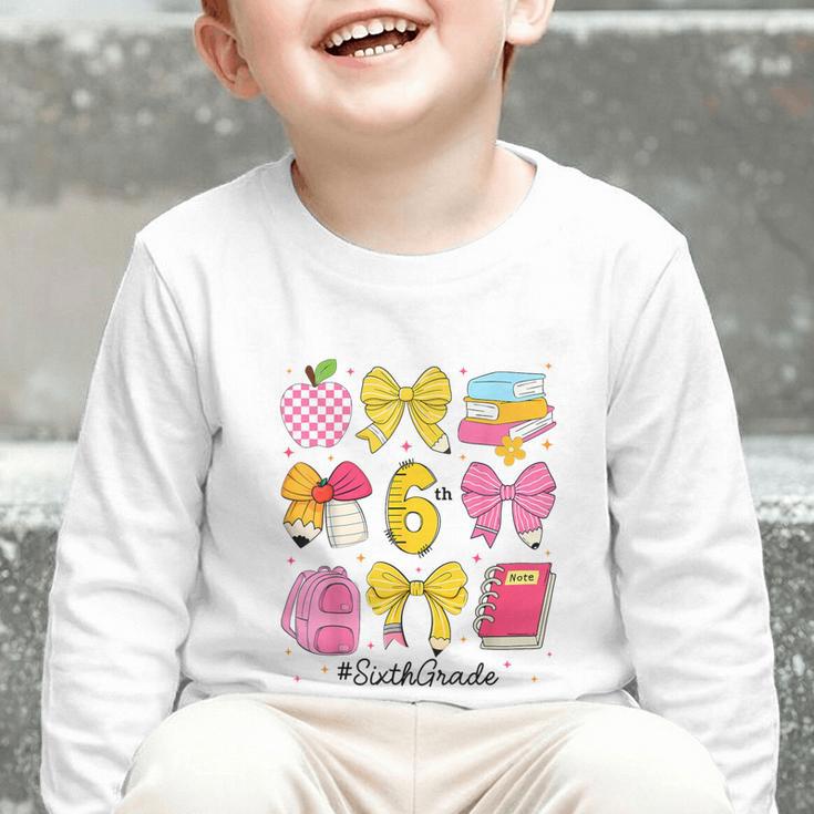 Hello Sixth 6th Grade Back To School Coquette Bow Girls Graphic Toddler Long Sleeve Tee Hello Sixth 6th Grade Back To School Coquette Bow Girls Graphic Toddler Long Sleeve Tee
