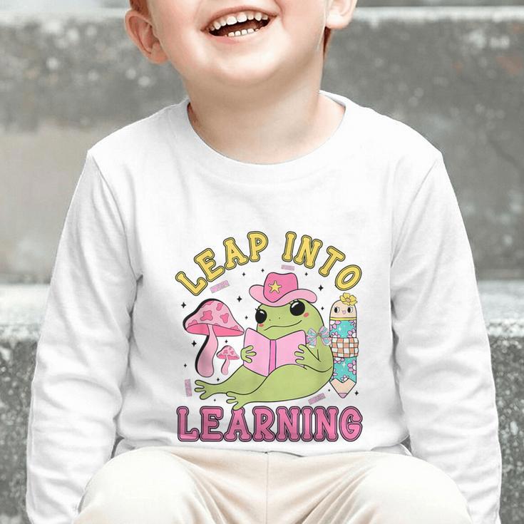 Leap Into Learning Cute Frog Kawaii Back To School Kids Graphic Toddler Long Sleeve Tee Leap Into Learning Cute Frog Kawaii Back To School Kids Graphic Toddler Long Sleeve Tee