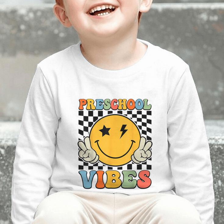 Preschool Vibes Retro Groovy Back To School Pre-K Graphic Toddler Long Sleeve Tee Preschool Vibes Retro Groovy Back To School Pre-K Graphic Toddler Long Sleeve Tee