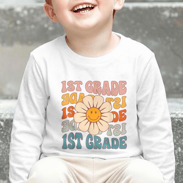 Retro 1st Grade Daisy Colorful Back To School First Grade Graphic Toddler Long Sleeve Tee Retro 1st Grade Daisy Colorful Back To School First Grade Graphic Toddler Long Sleeve Tee