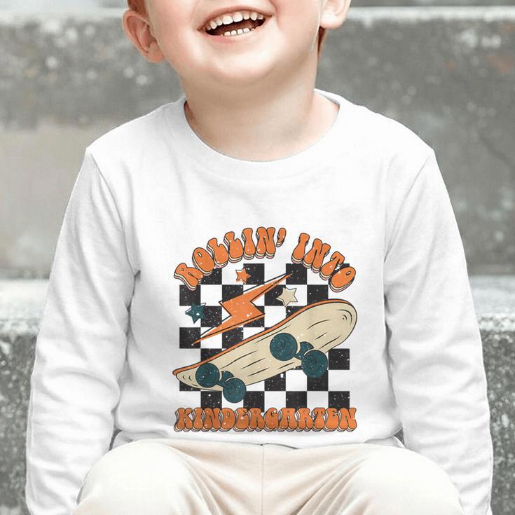 Rolling Into Kindergarten Retro Groovy Back To School Kids Graphic Toddler Long Sleeve Tee Rolling Into Kindergarten Retro Groovy Back To School Kids Graphic Toddler Long Sleeve Tee
