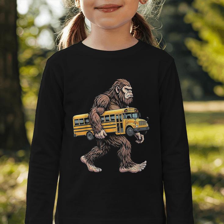 Bigfoot Carrying School Bus Sasquatch Back To School Graphic Toddler Long Sleeve Tee
