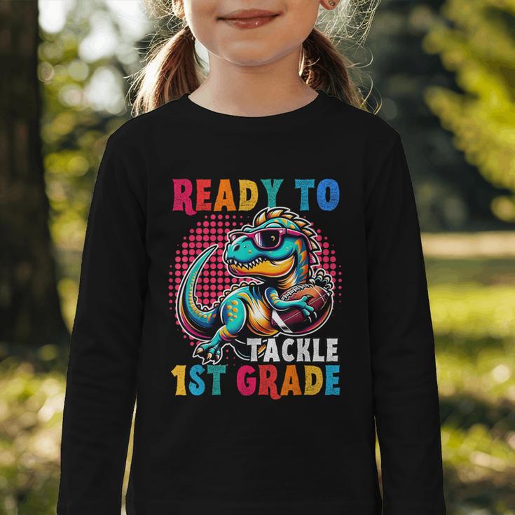 First Day Back To School 1st Grade Boys Football Dinosaur Graphic Toddler Long Sleeve Tee First Day Back To School 1st Grade Boys Football Dinosaur Graphic Toddler Long Sleeve Tee