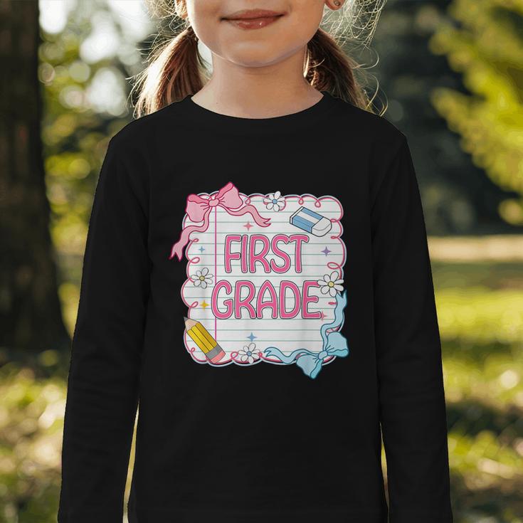 First Grade Back To School Girls Kids Coquette Bows Retro Graphic Toddler Long Sleeve Tee First Grade Back To School Girls Kids Coquette Bows Retro Graphic Toddler Long Sleeve Tee