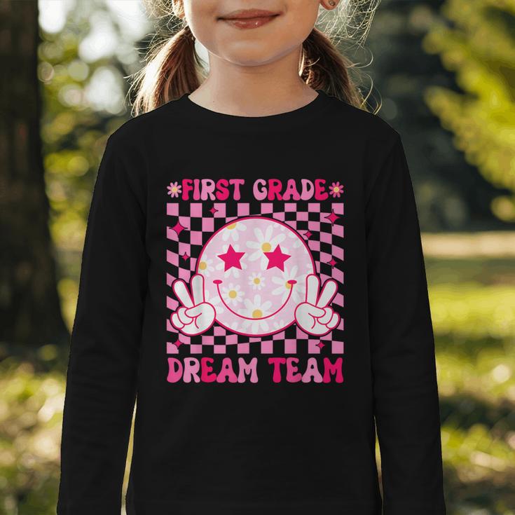 Groovy First Grade Dream Team Back To School 1st Grade Squad Graphic Toddler Long Sleeve Tee Groovy First Grade Dream Team Back To School 1st Grade Squad Graphic Toddler Long Sleeve Tee
