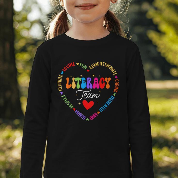 Groovy Literacy Team Reading Appreciation Back To School Graphic Toddler Long Sleeve Tee Groovy Literacy Team Reading Appreciation Back To School Graphic Toddler Long Sleeve Tee