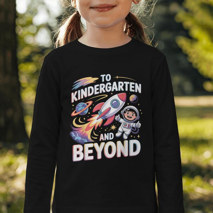 To Kindergarten And Beyond Astronaut Back To School Graphic Toddler Long Sleeve Tee To Kindergarten And Beyond Astronaut Back To School Graphic Toddler Long Sleeve Tee