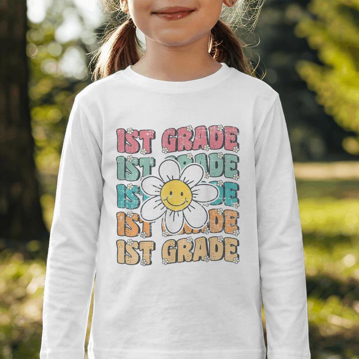 Groovy 1st Grade Back To School First Day Of First Grade Graphic Toddler Long Sleeve Tee