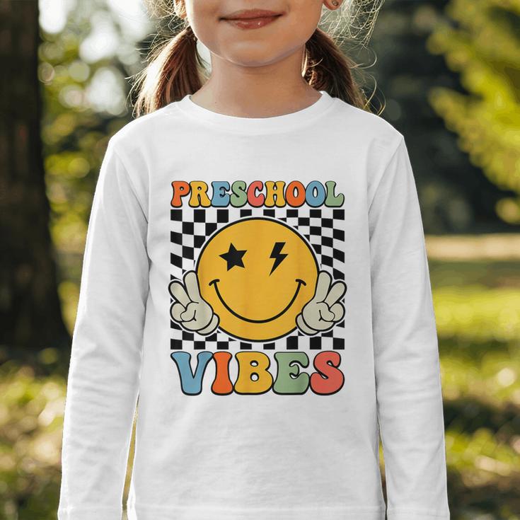Preschool Vibes Retro Groovy Back To School Pre-K Graphic Toddler Long Sleeve Tee Preschool Vibes Retro Groovy Back To School Pre-K Graphic Toddler Long Sleeve Tee