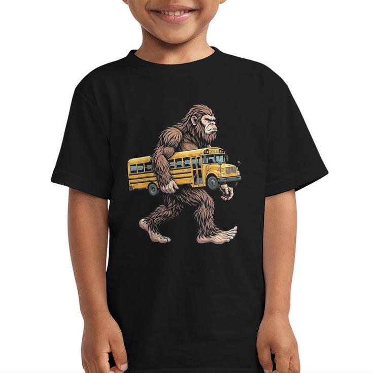 Bigfoot Carrying School Bus Sasquatch Back To School Graphic Kid T-Shirt