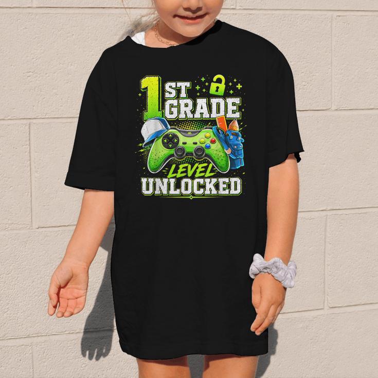 Back To School 1st First Grade Level Unlocked Gamer Kid Graphic Kid T-Shirt Back To School 1st First Grade Level Unlocked Gamer Kid Graphic Kid T-Shirt