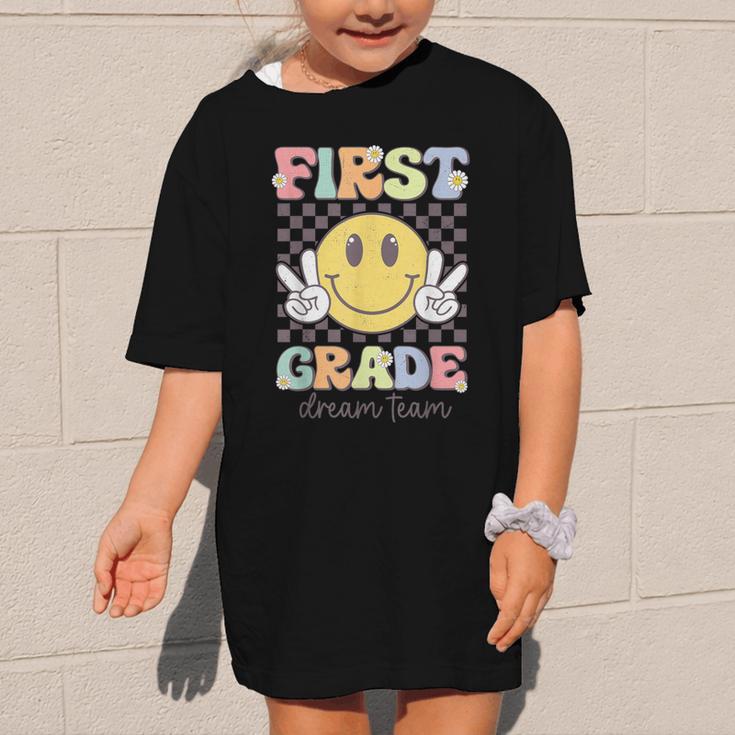 First Grade Dream Team Smile Face Back To School 1st Grade Graphic Kid T-Shirt First Grade Dream Team Smile Face Back To School 1st Grade Graphic Kid T-Shirt