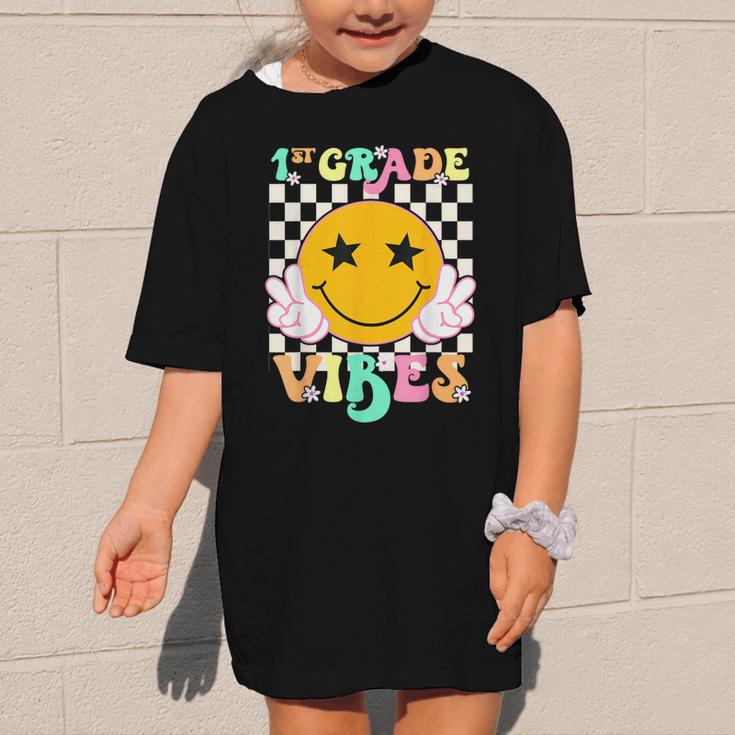 Girls 1st Grade Vibes Smile Face Back To School 1st Grade Graphic Kid T-Shirt Girls 1st Grade Vibes Smile Face Back To School 1st Grade Graphic Kid T-Shirt