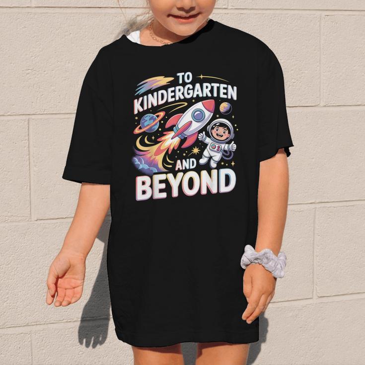 To Kindergarten And Beyond Astronaut Back To School Graphic Kid T-Shirt To Kindergarten And Beyond Astronaut Back To School Graphic Kid T-Shirt