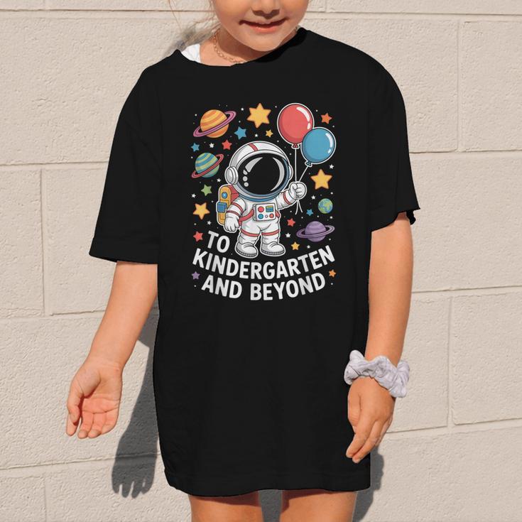 To Kindergarten And Beyond Astronaut Space Back To School Graphic Kid T-Shirt To Kindergarten And Beyond Astronaut Space Back To School Graphic Kid T-Shirt
