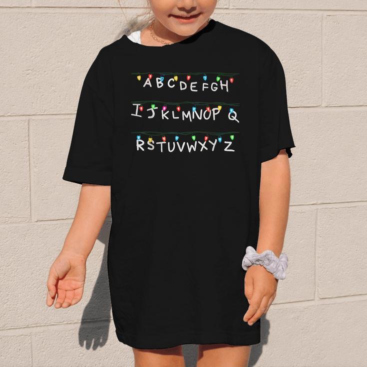 Stranger Wall Alphabet Lights Spooky Back To School Graphic Kid T-Shirt Stranger Wall Alphabet Lights Spooky Back To School Graphic Kid T-Shirt