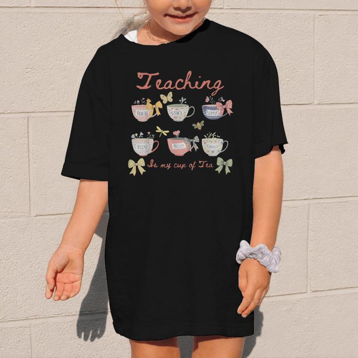 Teaching Is My Cup Of Tea Coquette Bow Floral Back To School Graphic Kid T-Shirt Teaching Is My Cup Of Tea Coquette Bow Floral Back To School Graphic Kid T-Shirt