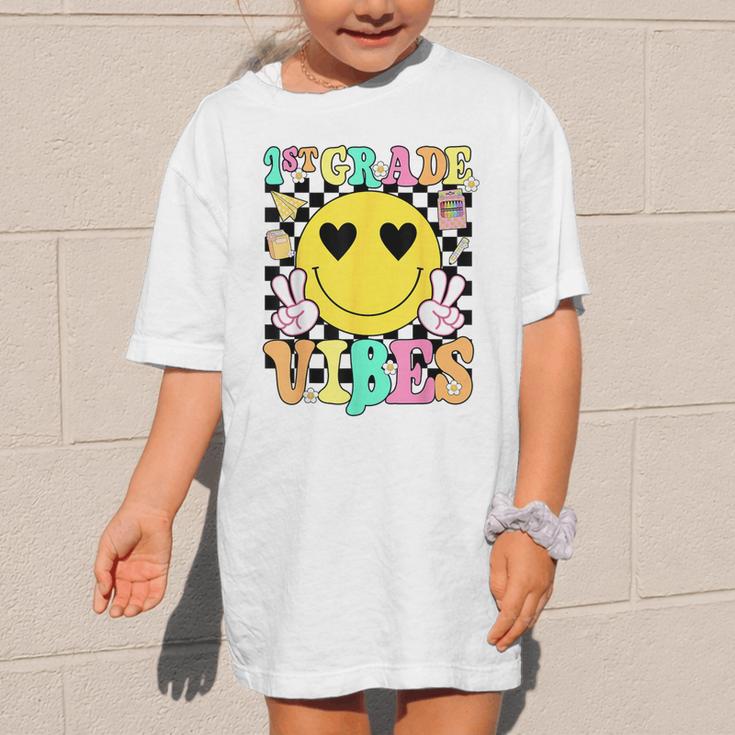 Girls 1st Grade Vibes Smile Face Back To School First Grade Graphic Kid T-Shirt Girls 1st Grade Vibes Smile Face Back To School First Grade Graphic Kid T-Shirt