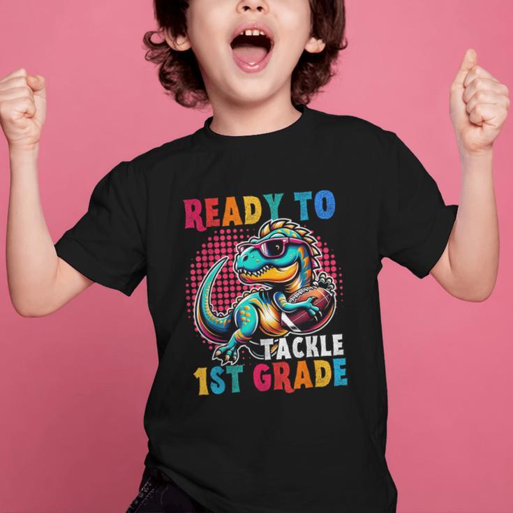 First Day Back To School 1st Grade Boys Football Dinosaur Graphic Kid T-Shirt First Day Back To School 1st Grade Boys Football Dinosaur Graphic Kid T-Shirt