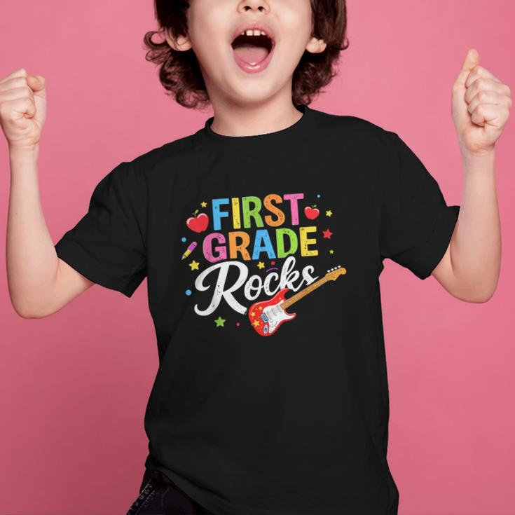 First Grade Rocks Colorful Back To School Guitar Graphic Kid T-Shirt First Grade Rocks Colorful Back To School Guitar Graphic Kid T-Shirt