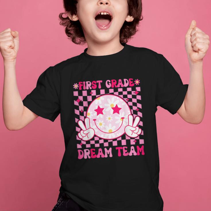 Groovy First Grade Dream Team Back To School 1st Grade Squad Graphic Kid T-Shirt