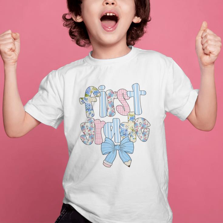 First Grade Coquette Bow Pencil First Day Back To School Performance Graphic Kid T-Shirt First Grade Coquette Bow Pencil First Day Back To School Performance Graphic Kid T-Shirt